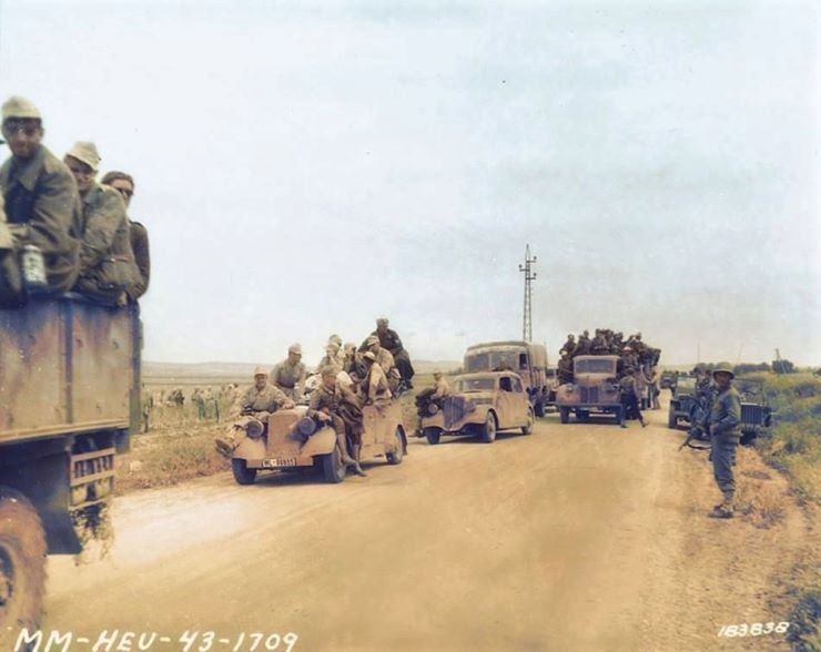 GermantroopsproceedingtoPOWcampsintheirownmotortransport.jpg.8eacbbfed6f19eaddbd413a2760a6d64.jpg