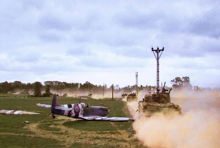 BritisharmorpassingdownedSpitfireinNormandy17June44.jpg.8f6079b3304da8125a66c2a6c4c5d592.jpg