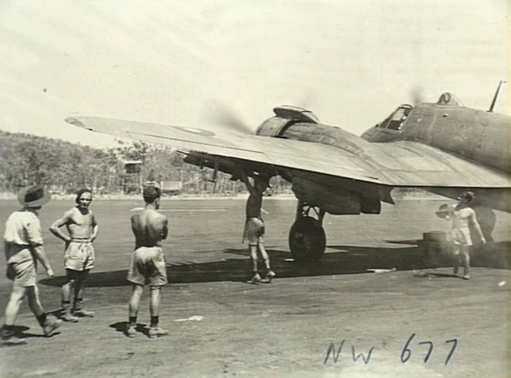 Sqn 31 RAAF armourer fuses rocket projectile Nov 44.png